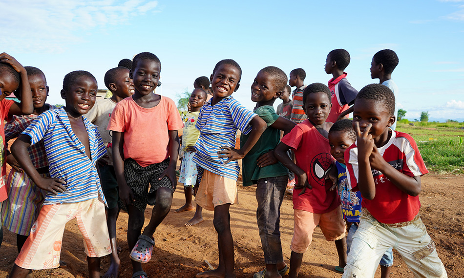 Photo of group of kids posing funny in front of the camera in Malawi
